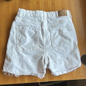 White ripped jean shorts